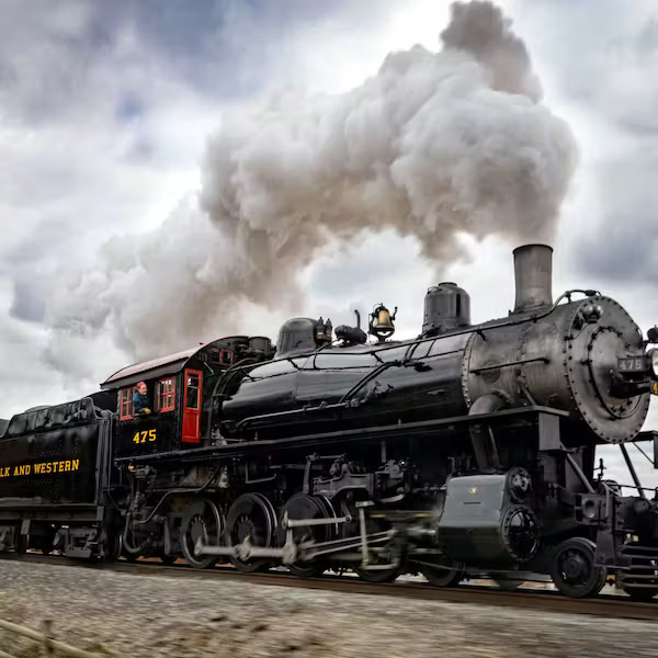 HOW DO TRAIN WHEELS MAINTAIN TRACTION WITH THE TRACK IN WET OR ICY CONDITIONS ?