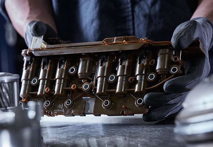 TRANSMISSION REBUILD VS. REPLACE transmission shop